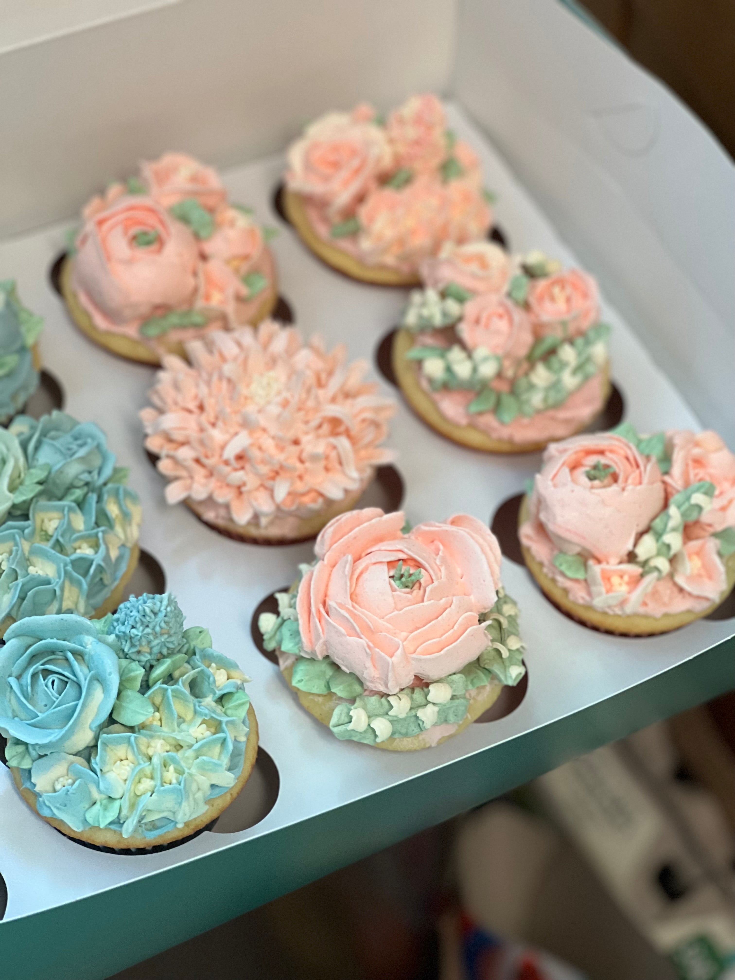 Floral baby 2024 shower cupcakes